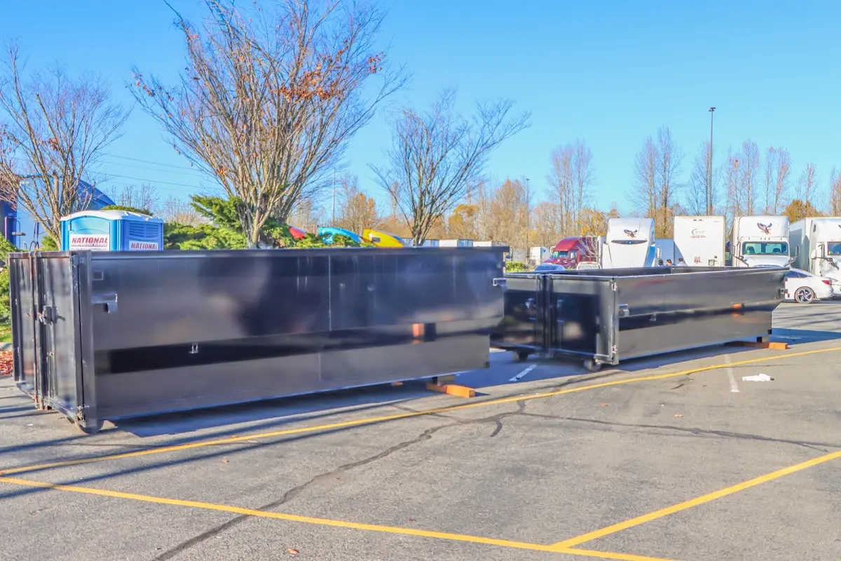 Professional dumpster rental service with roll-off container on residential driveway in Middleburg Heights